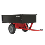 12 cubic foot steel dump cart placed in the lawn attached to lawn mower.