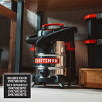CRAFTSMAN 10 gallon stainless steel shop vac on workshop floor with hose wrapped and powerhead