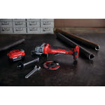 Brushless s d s plus cordless rotary hammer tool placed on the table unarranged.