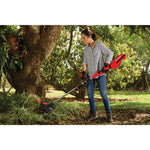 60 volt cordless 15 inch brushless weedwacker string trimmer with quickwind kit 2.5 ampere per hour being used by a person.