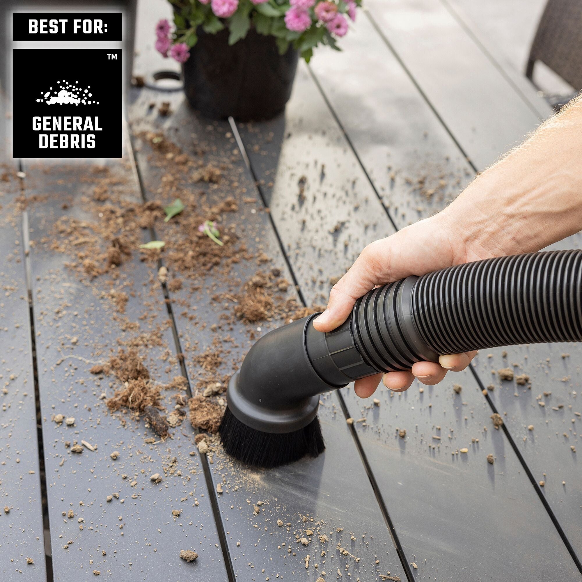 Homeowner using CRAFTSMAN Vac with HEPA Media Filter, Dusting Brush to pickup soil and dirt on deck