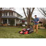 Cordless 21 inch 3 in 1 lawn mower kit 5 amp hour being used for mowing grass by person.