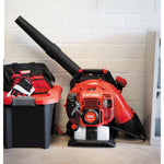51 C C 2 cycle gas backpack leaf blower stored indoors.