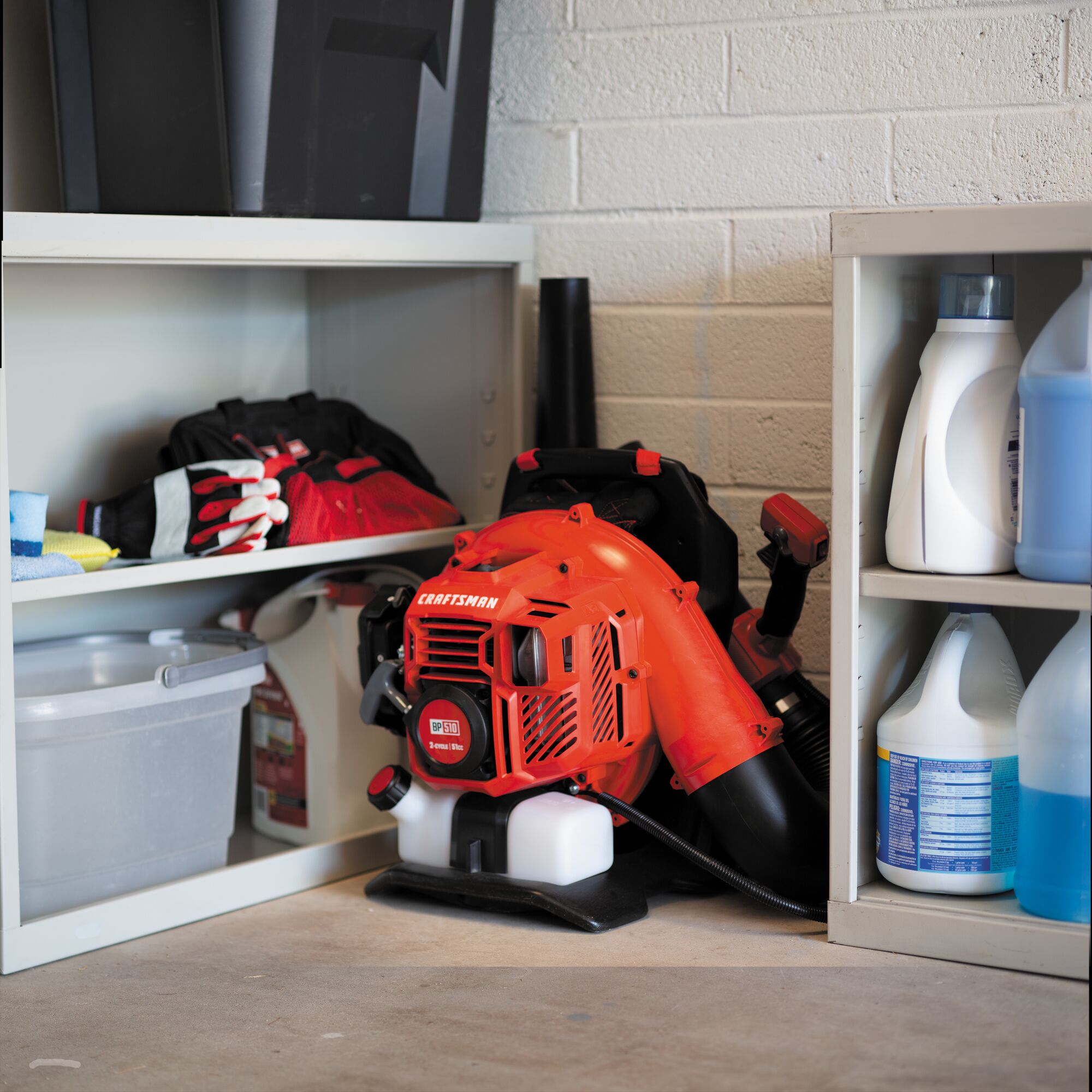 51 C C 2 cycle gas backpack leaf blower stored indoors.