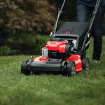 21 inch 140 c c f w d self propelled mower being used to mow the lawn.