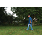 Wood handle thatching rake being carried by person.