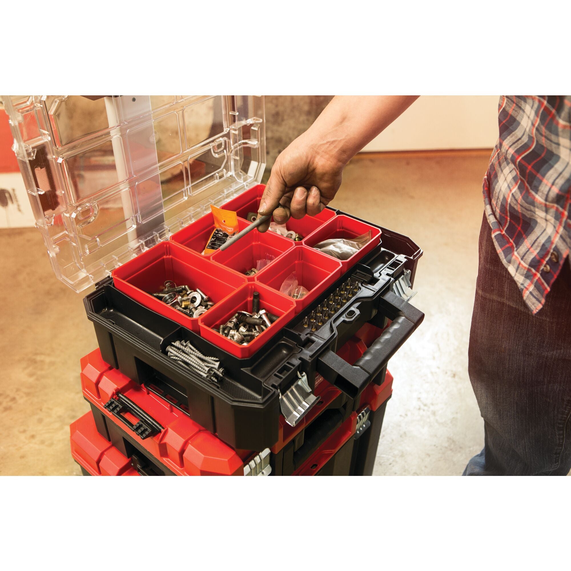 Person putting screw in top organizer of VersaStack System Tower.