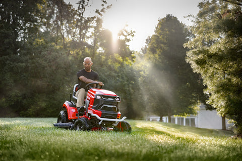 man driving craftsman CMCRM233303 riding mower