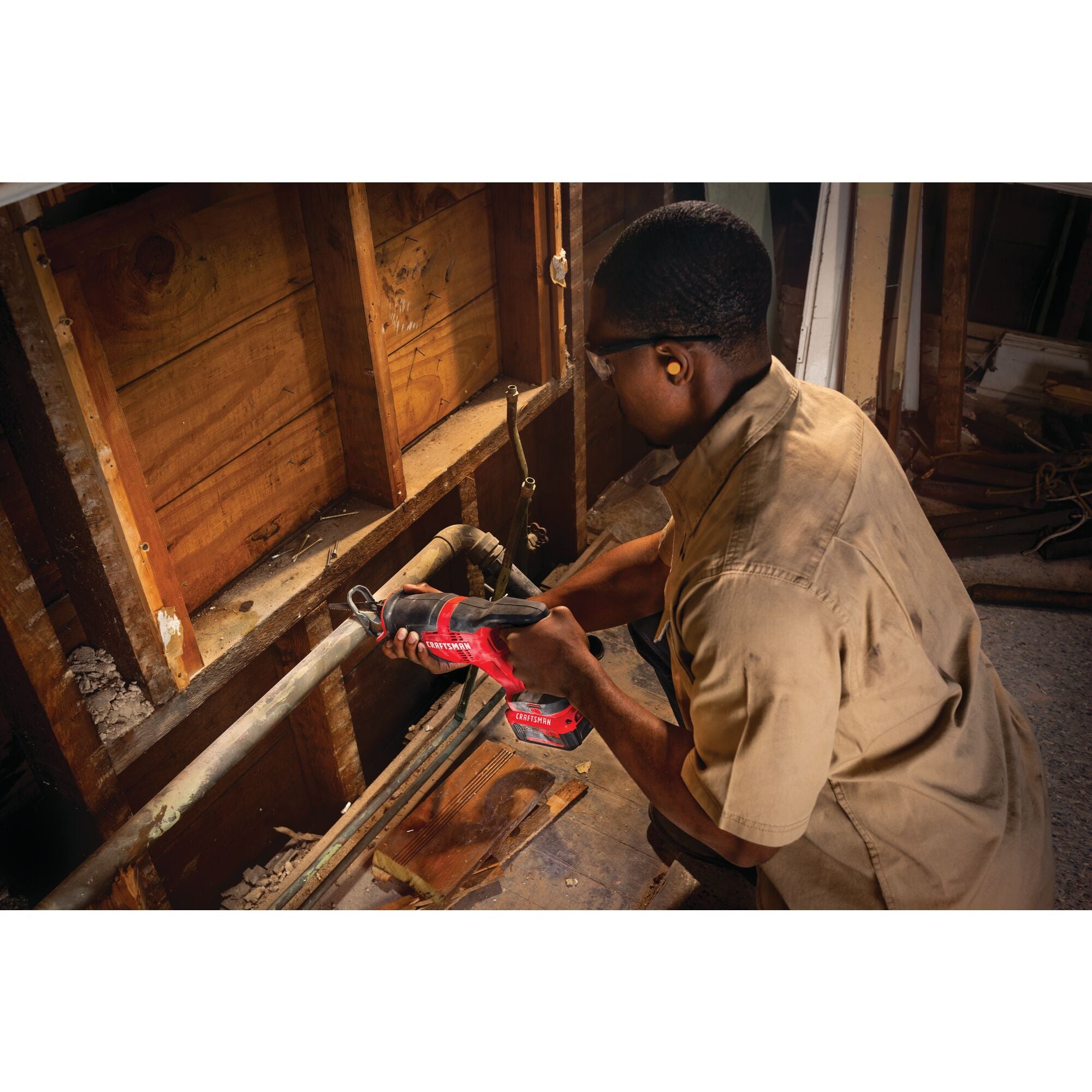 Cordless half inch drill and driver kit 1 battery being used for drilling in wooden door.