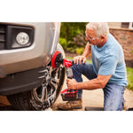 Side view of male cleaning truck tires with V20 Scrubber