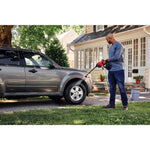 20 volt cordless 350 max P S I power cleaner kit being used by a person to clean car tyre.