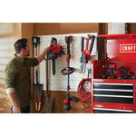 12 inch cordless compact chainsaw kit 4 amp hour is being hung on organization shelf.