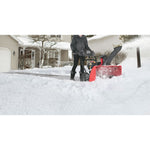 26 inch 208 CC electric start two stage snow blower being used.
