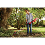 60 volt cordless 15 inch brushless weedwacker string trimmer with quickwind kit 2.5 ampere per hour being used by a person.