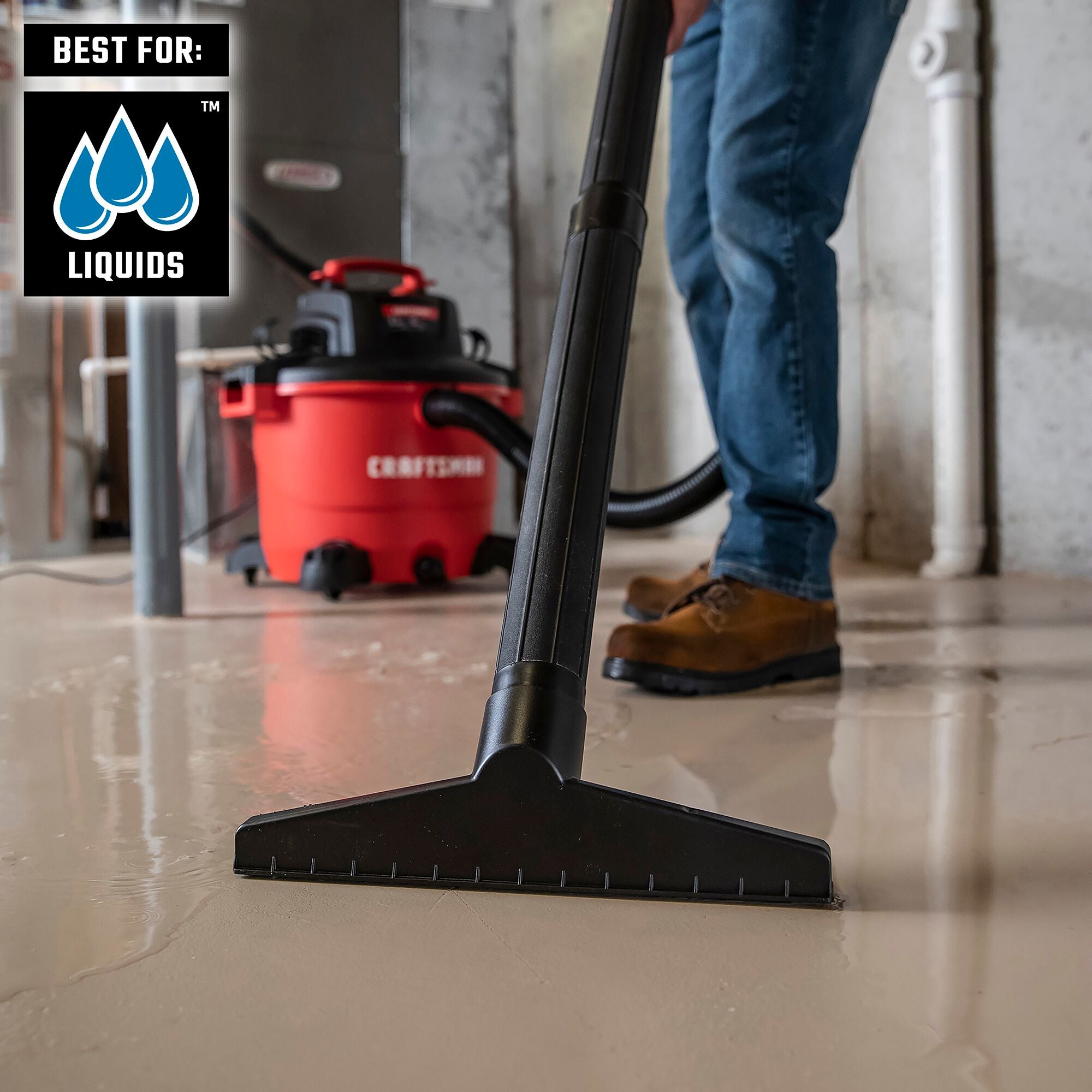 Homeowner using CRAFTSMAN wet/dry vacuum, wet filter and wet nozzle to cleanup water in basement