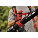 51 C C 2 cycle gas backpack leaf blower being carried by a person outdoors.
