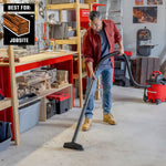 Man using 1-7/8 inch floor brush on CRAFTSMAN shop vacuum to clean sawdust on floor in garage