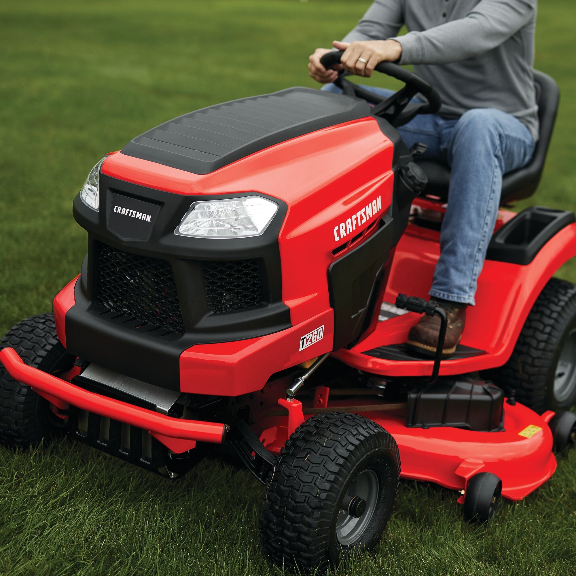 50 inch 23 h p hydrostatic riding mower with turn tight being used to mow the lawn.