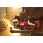 Cordless 4 and half inch small angle grinder kit 1 battery being used to cut tough material.