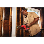 20 volt cordless reciprocating saw kit being used by a person indoors.