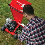 3 inch 250 c c chipper being used by a person.