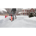 28 inch 243 CC electric start two stage snow blower being used.