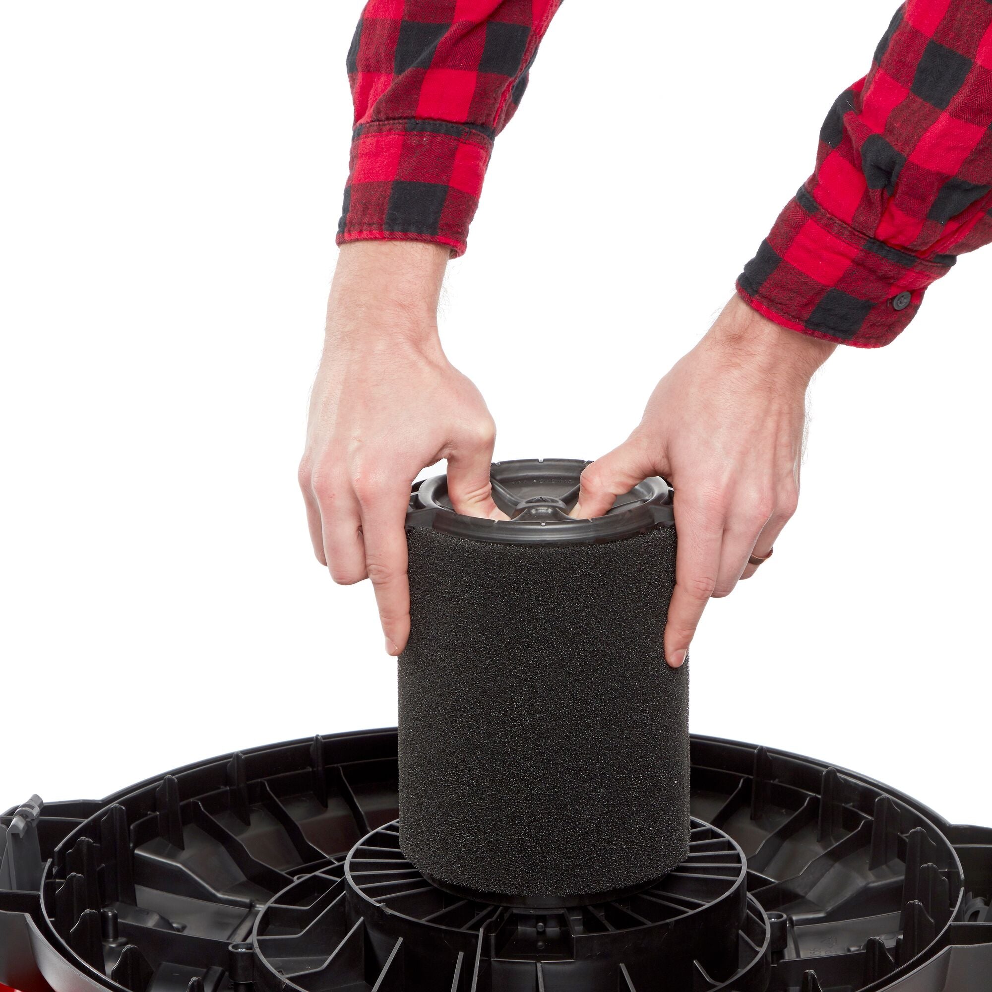 Person installing CRAFTSMAN Wet Application Replacement Filter onto wet/dry shop vac powerhead