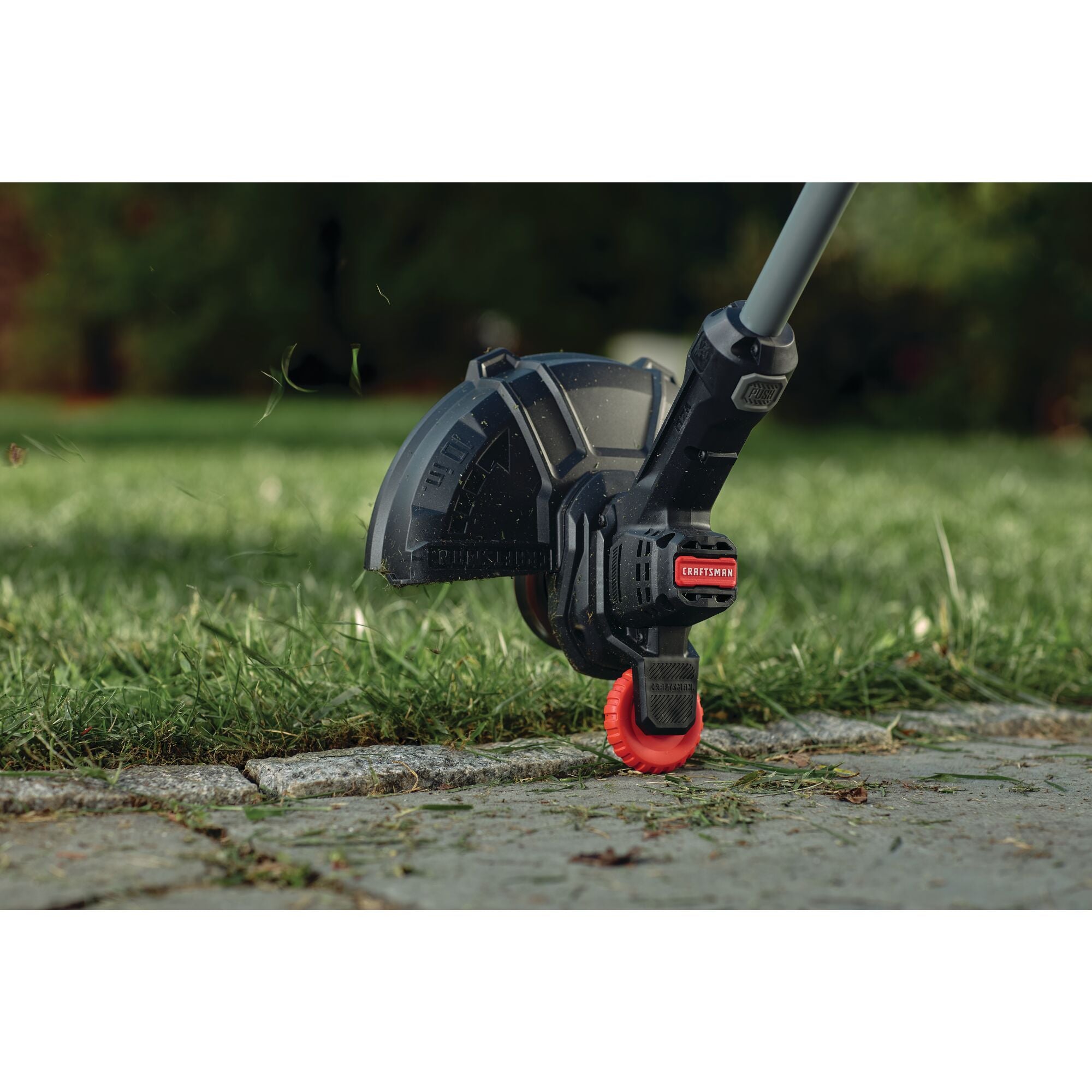 Integrated wheel edged guide feature of 20 volt cordless 10 inch weedwacker string trimmer and edger.