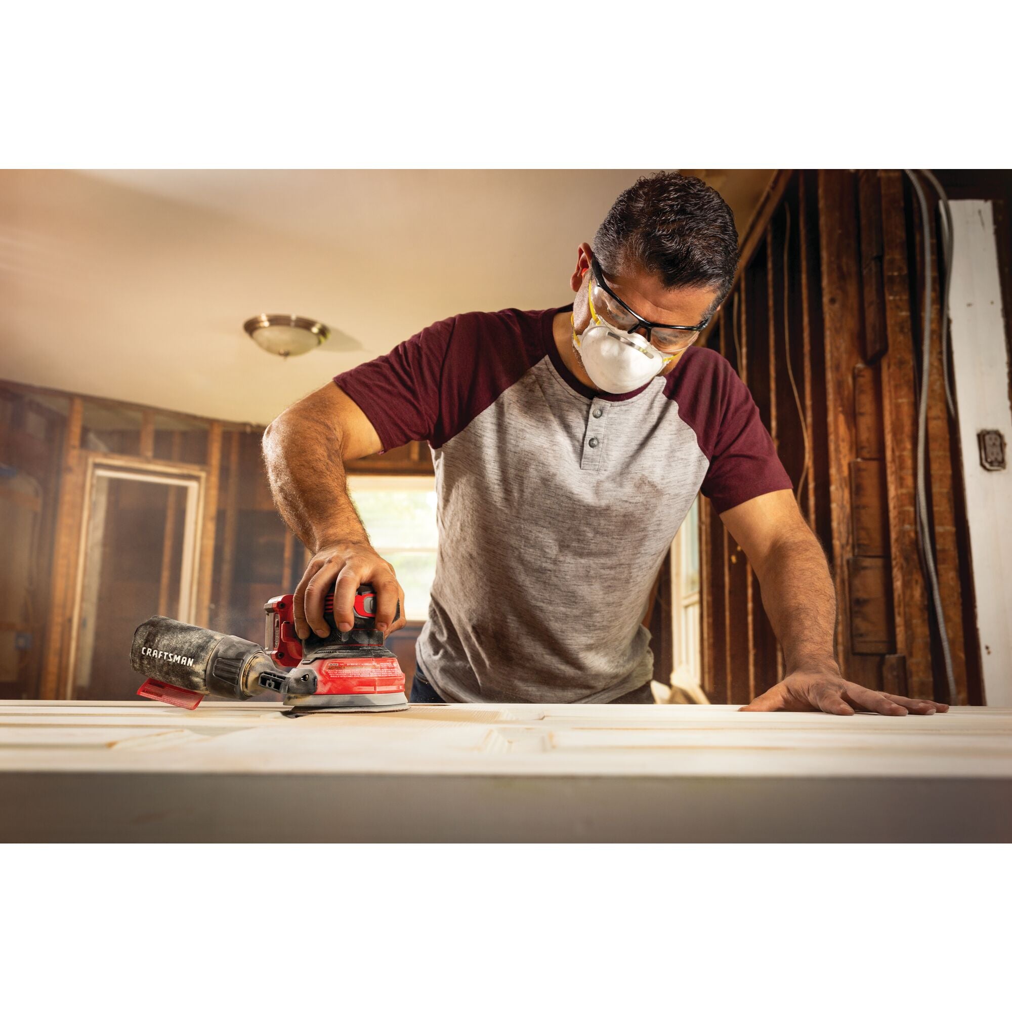 20 volt cordless random orbit sander being used by a person.