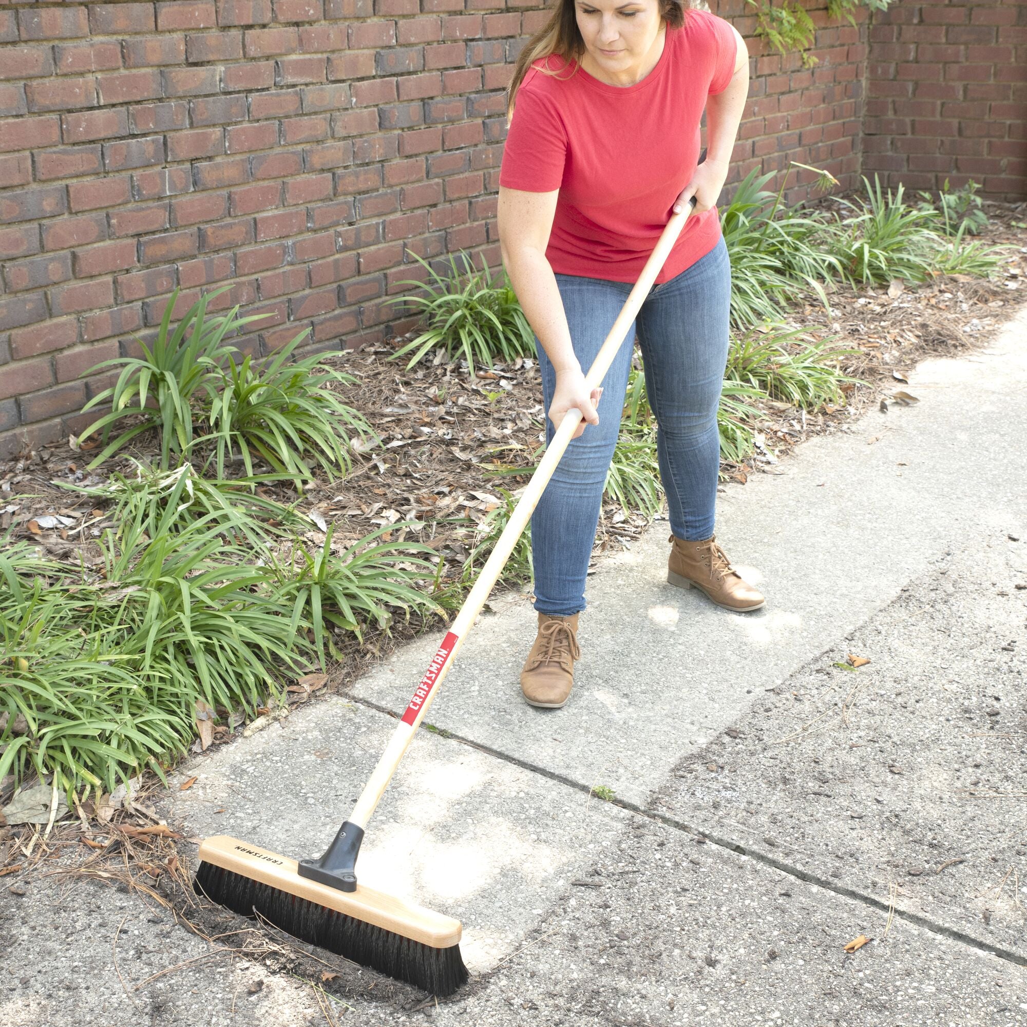 18 inch all-purpose push broom cleaning dirt off sidewalk