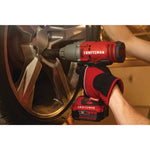 Cordless half inch impact wrench kit 1 battery being used to tighten tyre screws.