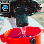 Person holding vac lid above drum while outside showing wet filter installed and drum full of water