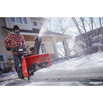 28 inch 243 CC electric start two stage snow blower being used.