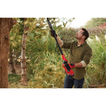 Cordless pole chainsaw kit 4 amp hour being used.