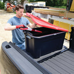 40 Gallon latching tote being used by a person to store tools.