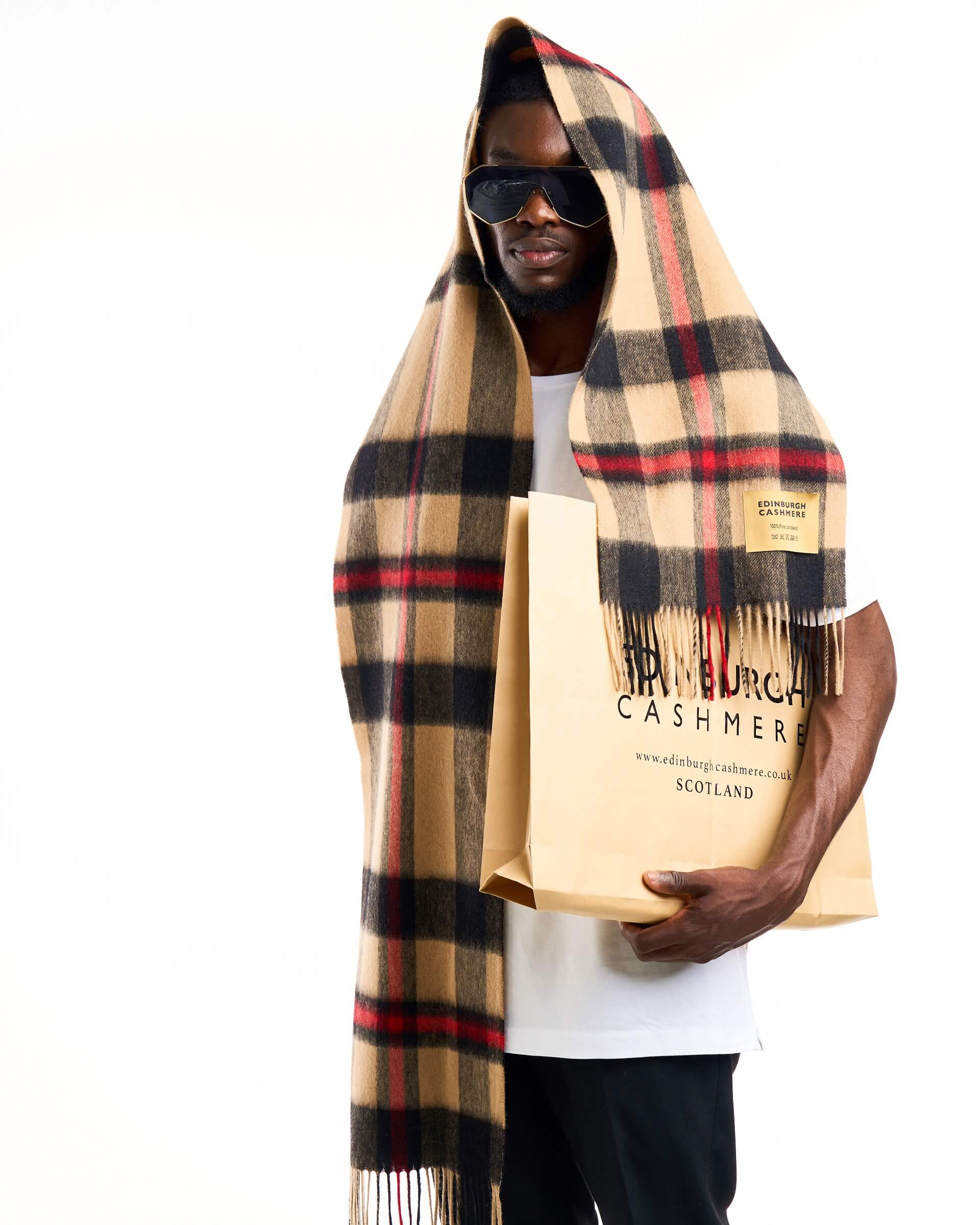 Luxury cashmere scarves DC Check design has featured in Vogue, GQ, Tatler and Grazia.