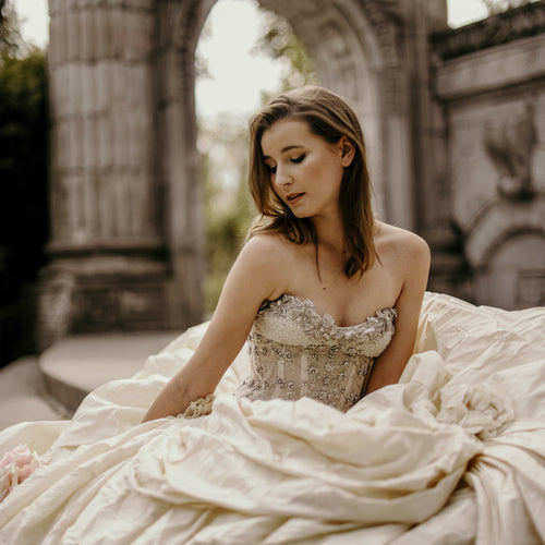 bride-sits-in-flowing-wedding-dress