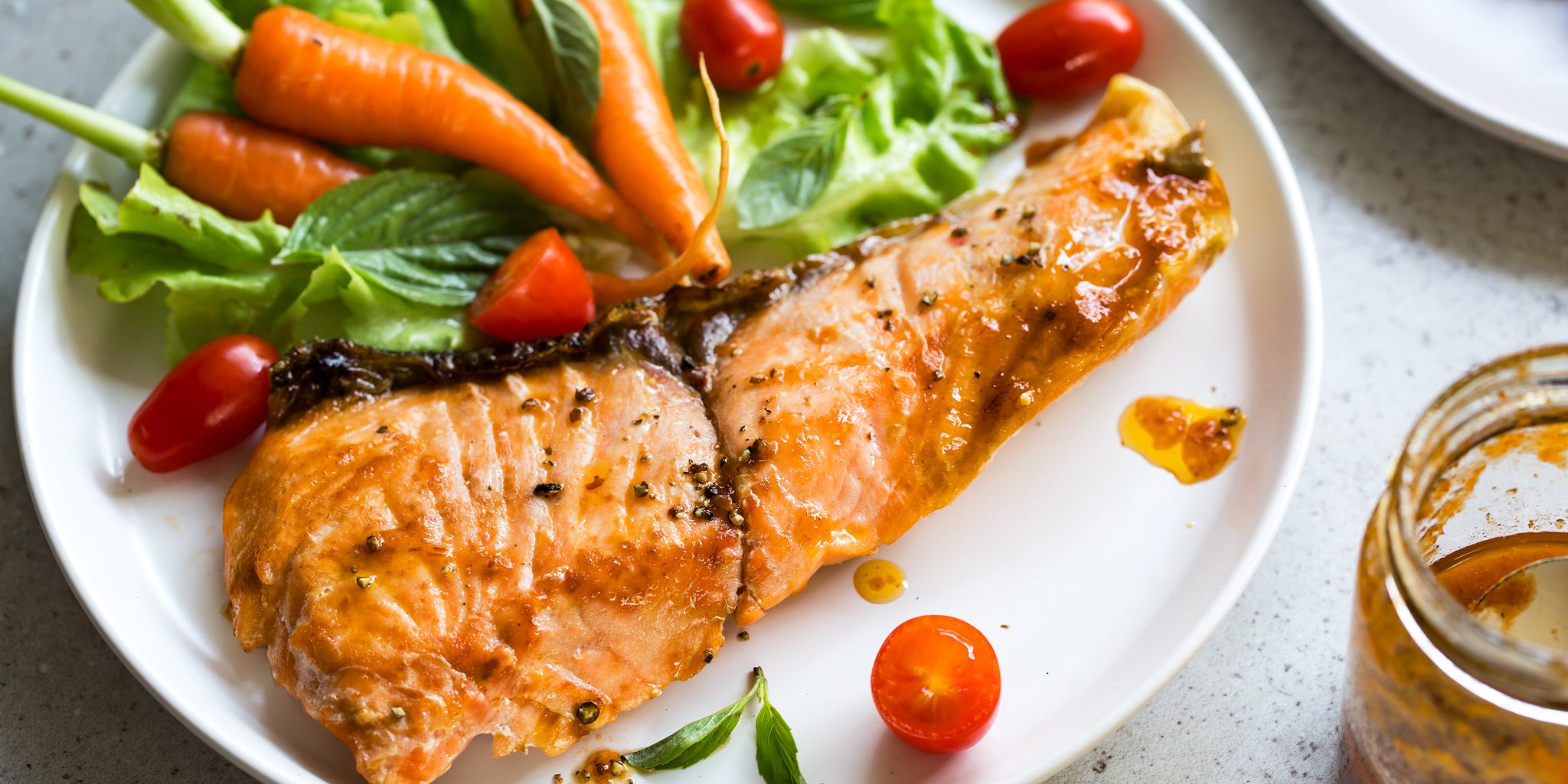 Vitamin D-rich foods, including salmon and a salad.