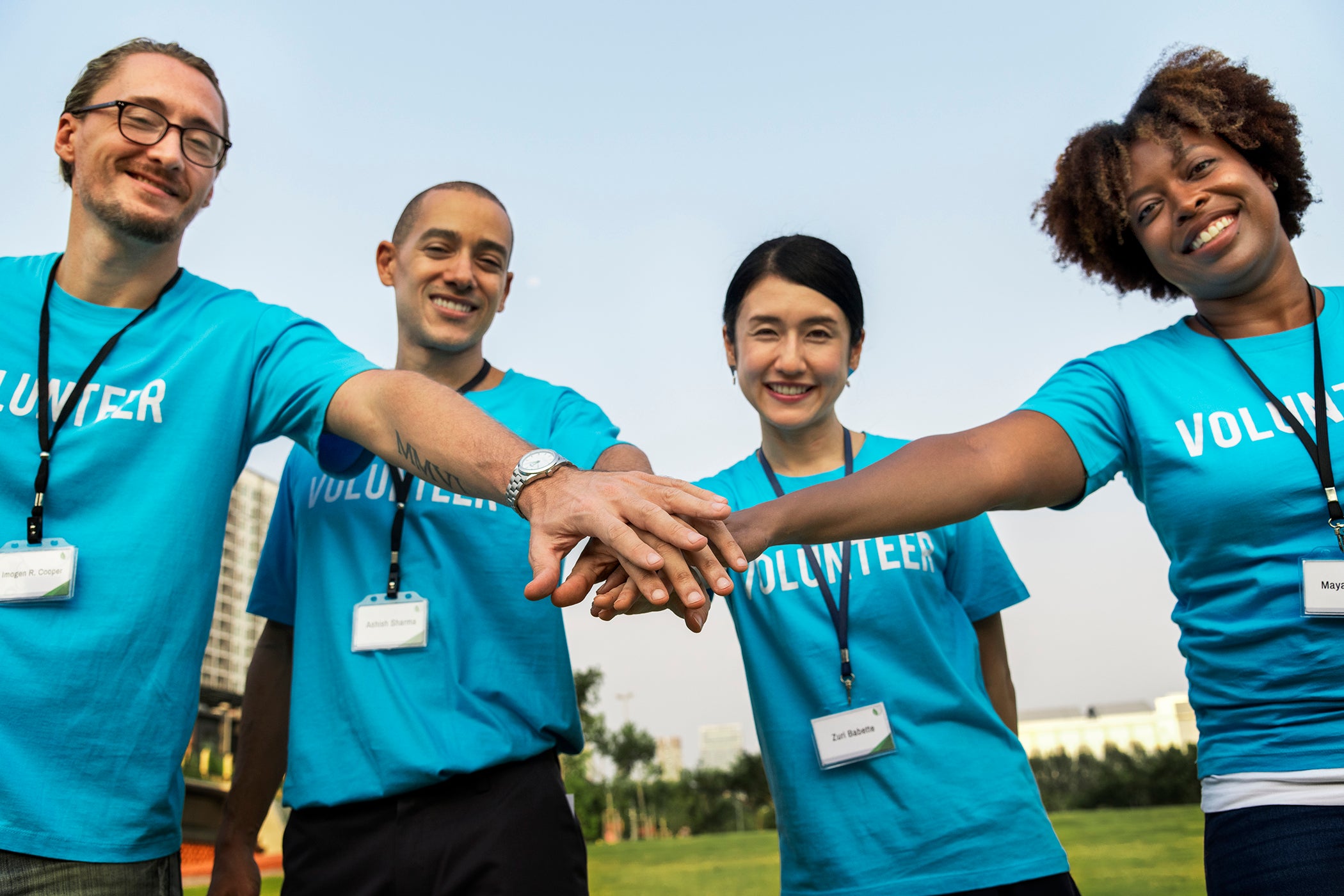 2-team-volunteers-stacking-hands