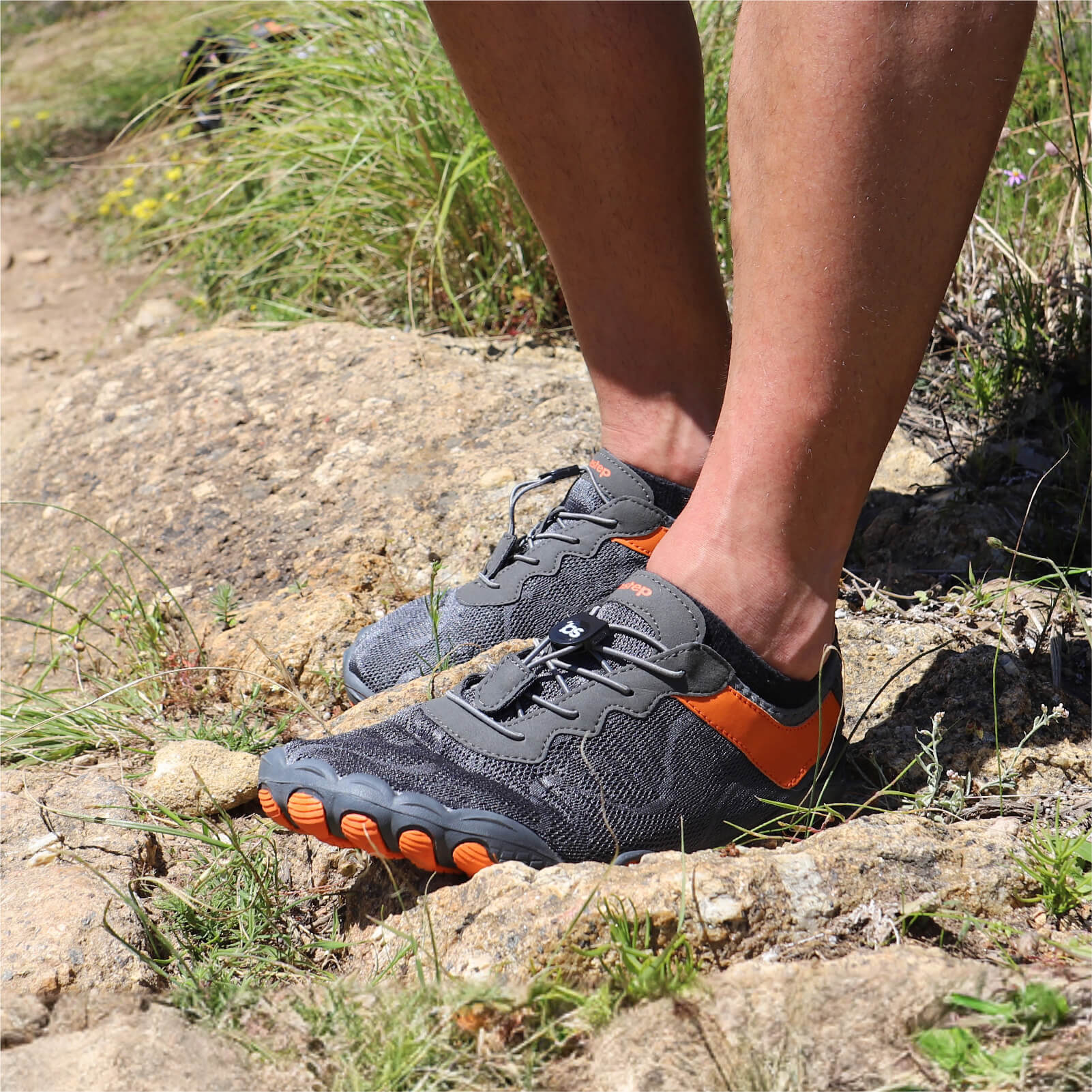 man wearing Barestep Active 2.0 barefoot shoe in nature, showcasing it's versatile design.