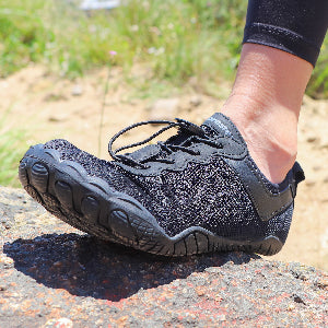 A woman wearing the Barestep Active 2.0 in a warm environment, showcasing the breathability of the materials.