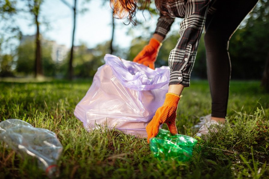 Girl Clearing Up Rubbish