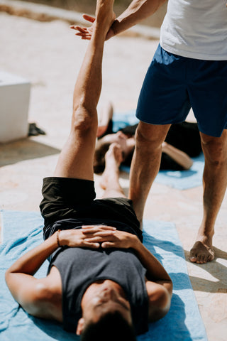 Men limbering up to become more flexible and relaxed for their training.