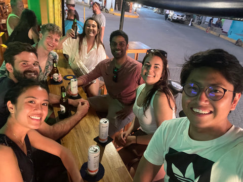 Sharing drinks with new friends on a group trip