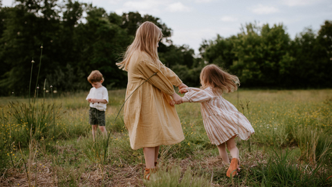 Children in Organic Clothing Playing in Field