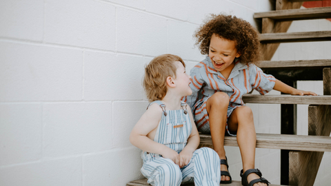 2 Boys in Sustainable Clothing Laughing