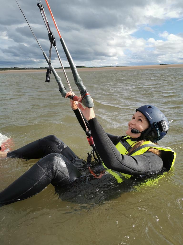 Person taking kitesurfing lesson