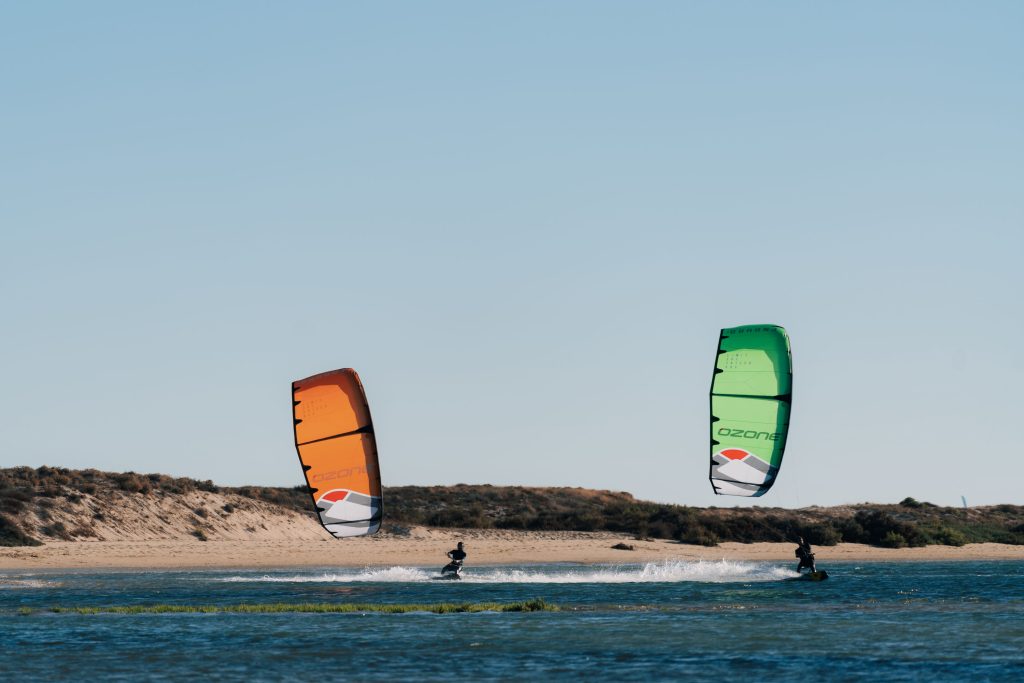 two people kitesurfing