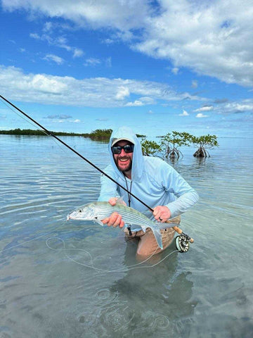 The author with a Belizean bonefish (caught with clear tippet)