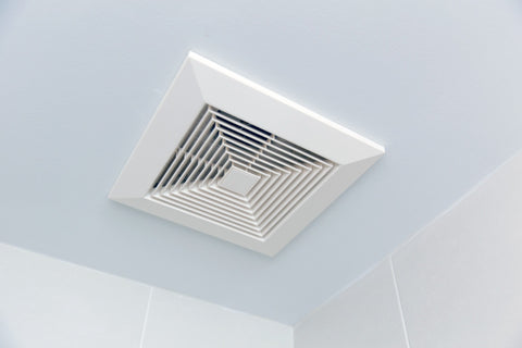 New bathroom exhaust fan installed through ceiling